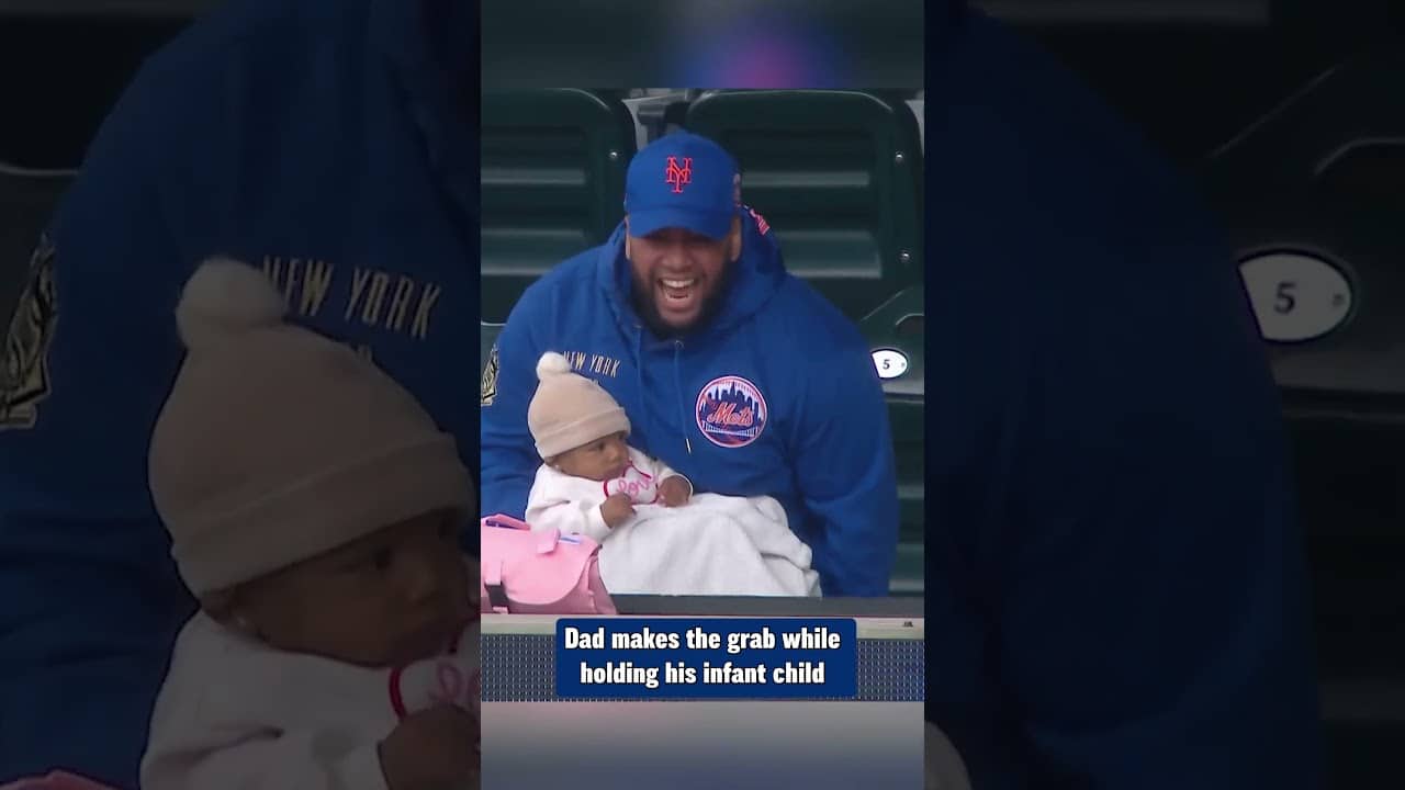 Baby in hand, no problem for Dad! He makes the one-handed grab while holding his infant child ๐ถ