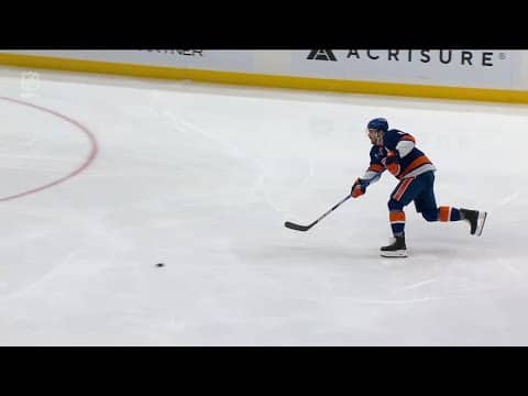 Luke Hughes scores a goal against the New York Islanders