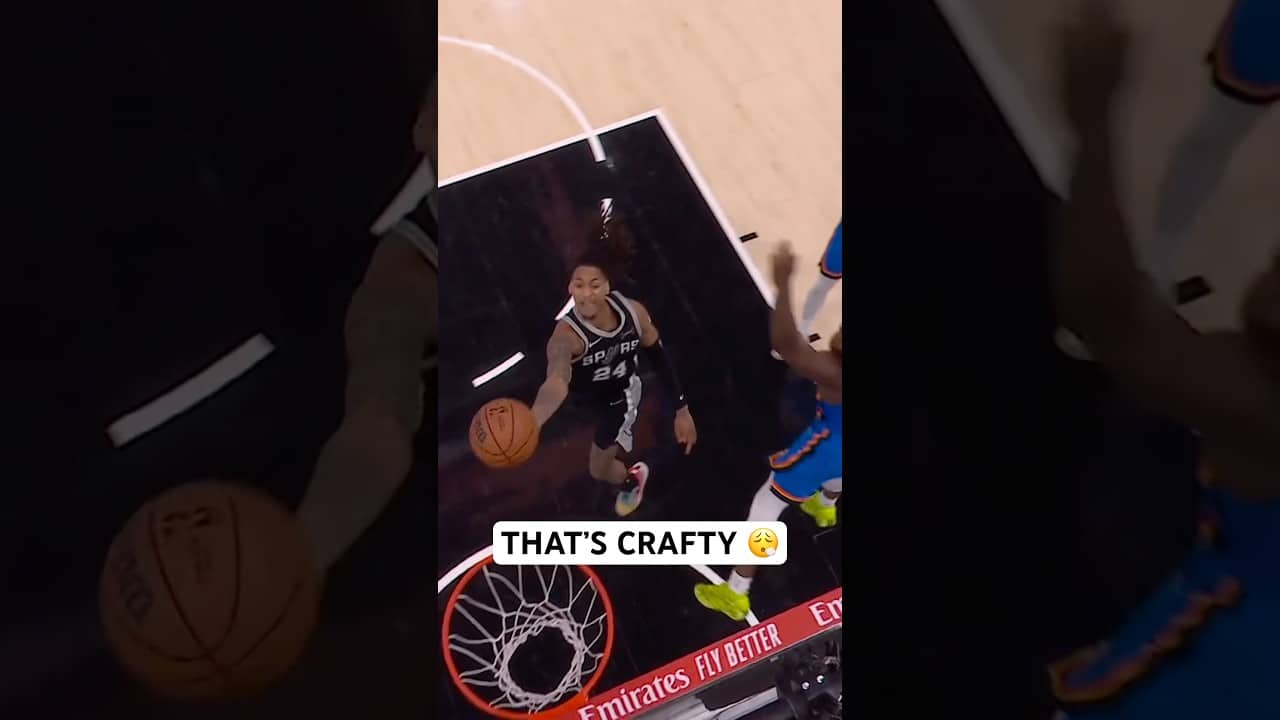Devin Vassell hangs in the air for the acrobatic layup