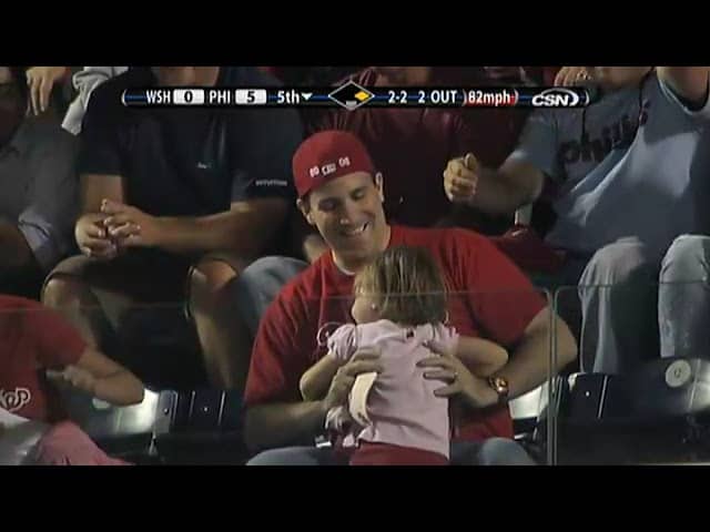 Dad makes tough catch, but daughter tosses ball back