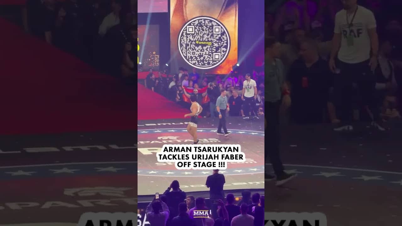 Arman Tsarukyan TACKLES Urijah Faber off the stage during their wrestling match at RAF 08!