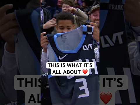 Keyonte George gives a young fan his jersey after the win
