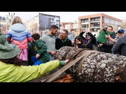 James Pantemis joins Timber Joey, Timber Jim and fans to bless the Victory Log