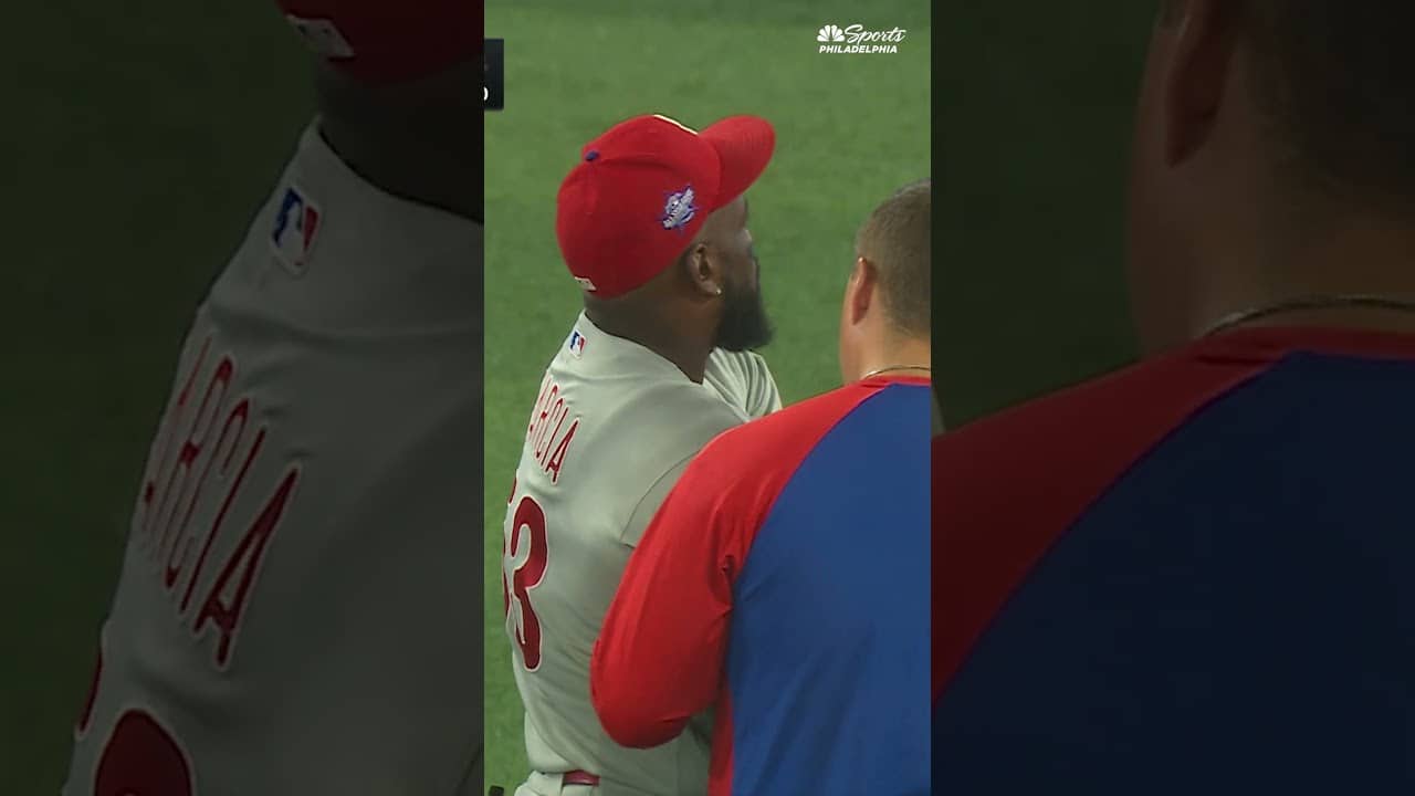 Adolis García leaves the game after throwing to home plate