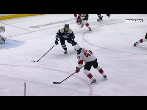 Luke Hughes scores a goal against the Columbus Blue Jackets