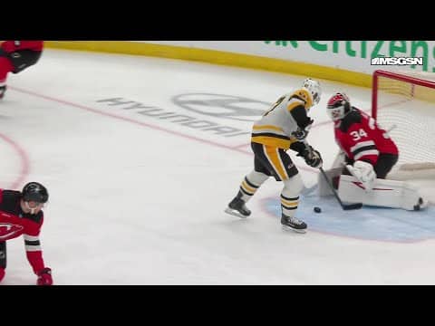 Evgeni Malkin scores a goal against the New Jersey Devils
