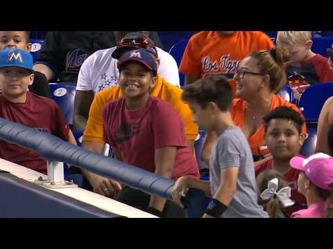 KC@MIA: Fan catches two foul balls in one at-bat