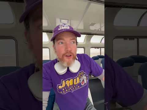 This JMU fan is traveling via train to watch his team in the CFP 🤯 (Via DMV Adventures/YouTube)