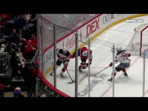 Luke Hughes scores a goal against the Washington Capitals