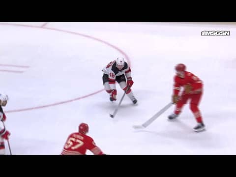 David Perron scores a goal against the New Jersey Devils