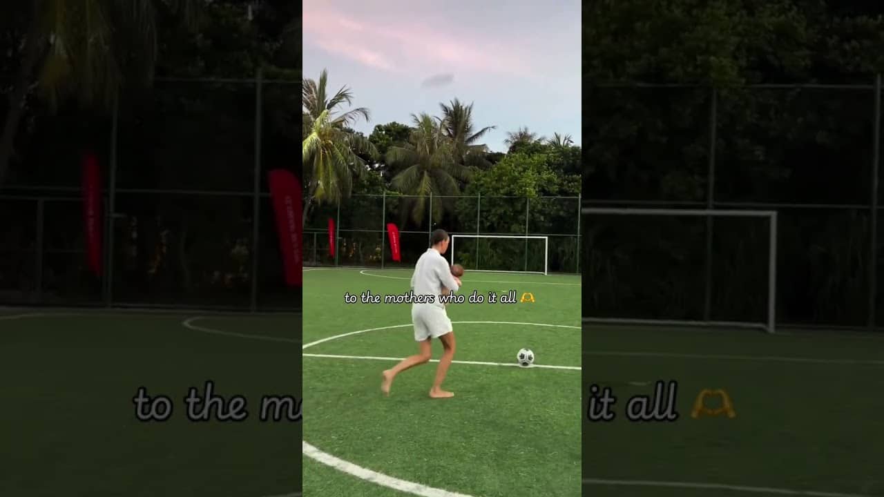 Completing the crossbar challenge with a baby in your hands is next level 😍 (via @soccer.boy.mum/TT)