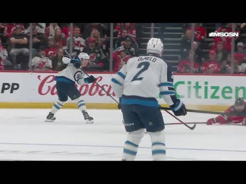 Nino Niederreiter scores a goal against the New Jersey Devils