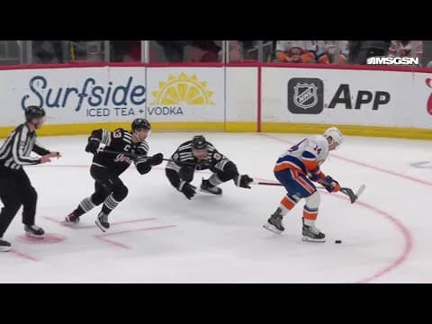 Bo Horvat scores a goal against the New Jersey Devils