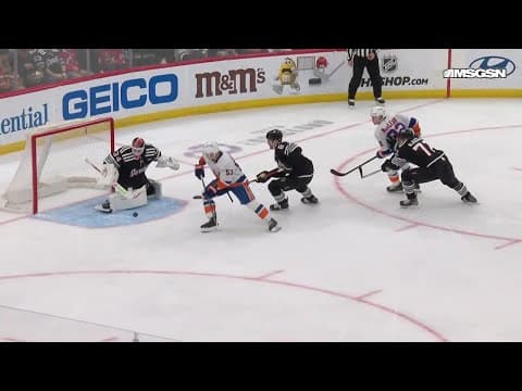 Casey Cizikas scores a goal against the New Jersey Devils