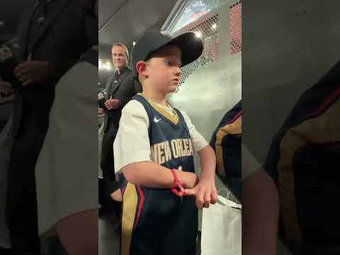 Zion spends time with a young fan after the game, poses for pics, signs his jersey & more! 🥹