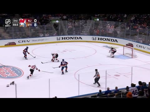 Casey Cizikas scores a goal against the New Jersey Devils