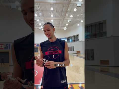 Zacch sees his first-ever bobblehead! #nba #hawks #zaccharierisacher #bobblehead