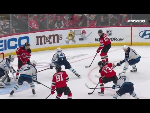Nico Hischier scores a goal against the Winnipeg Jets