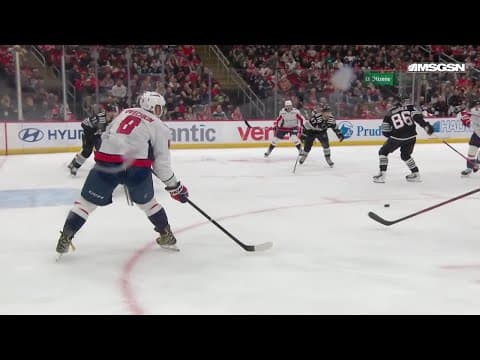 Alex Ovechkin scores a goal against the New Jersey Devils