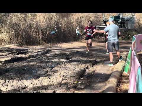 Runners attempt to run through the mud pit at the 2026 World Cross Country Championships