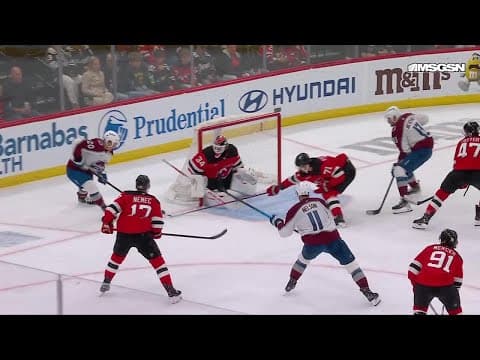Brock Nelson scores a goal against the New Jersey Devils
