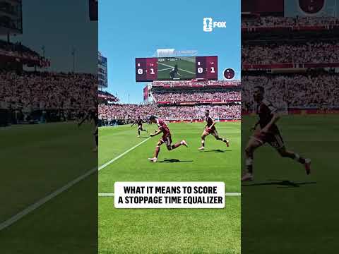 Pitchside angle of Qatar securing its first-ever FIFA World Cup point