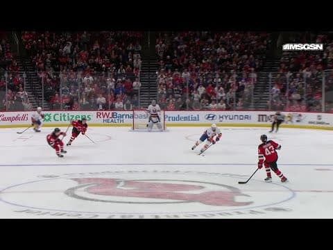 Mathew Barzal scores a goal against the New Jersey Devils