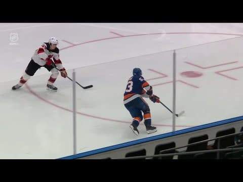 Casey Cizikas scores a goal against the New Jersey Devils