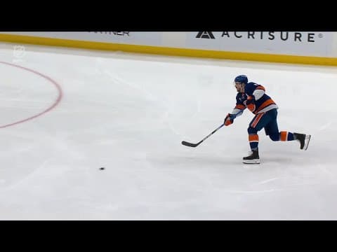 Mathew Barzal scores a goal against the New Jersey Devils