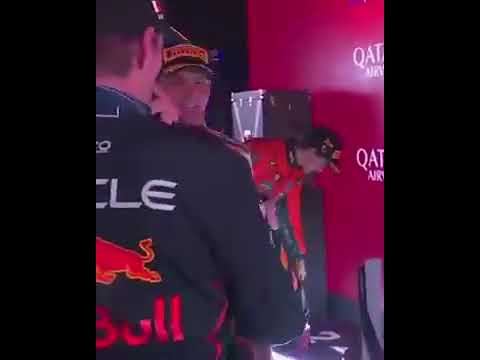 Max Verstappen and Red Bull’s principal strategy engineer Hannah Schmitz celebrate on the podium 👏🍾