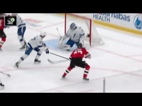 Luke Hughes scores a goal against the Tampa Bay Lightning