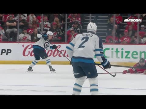 Nino Niederreiter scores a goal against the New Jersey Devils