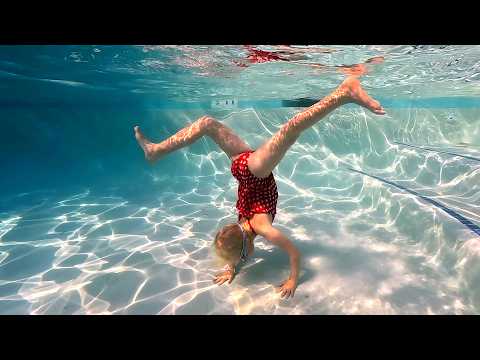 Katie and T Rex Swimming Underwater