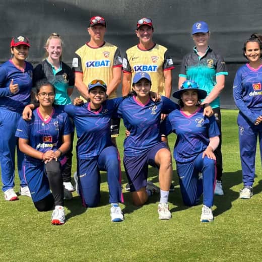 Coaches Simon Helmot and Carl Crowe, and UAE women's captain Esha Oza