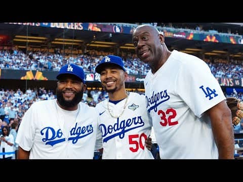 NBA legend Magic Johnson throws out the ceremonial first pitch prior to World Series Game 5 π